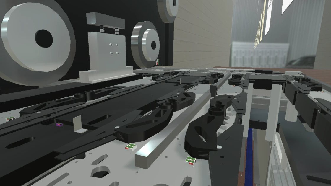 Close-up in the digital twin: transport table with holders for foil strips, behind it rollers and guides of the strip handling.